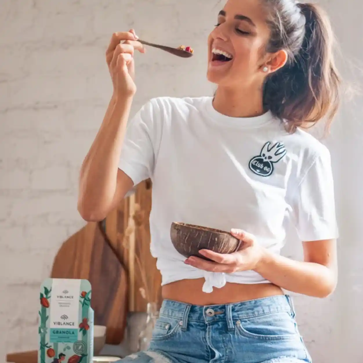 Happy girl eating Viblance granola